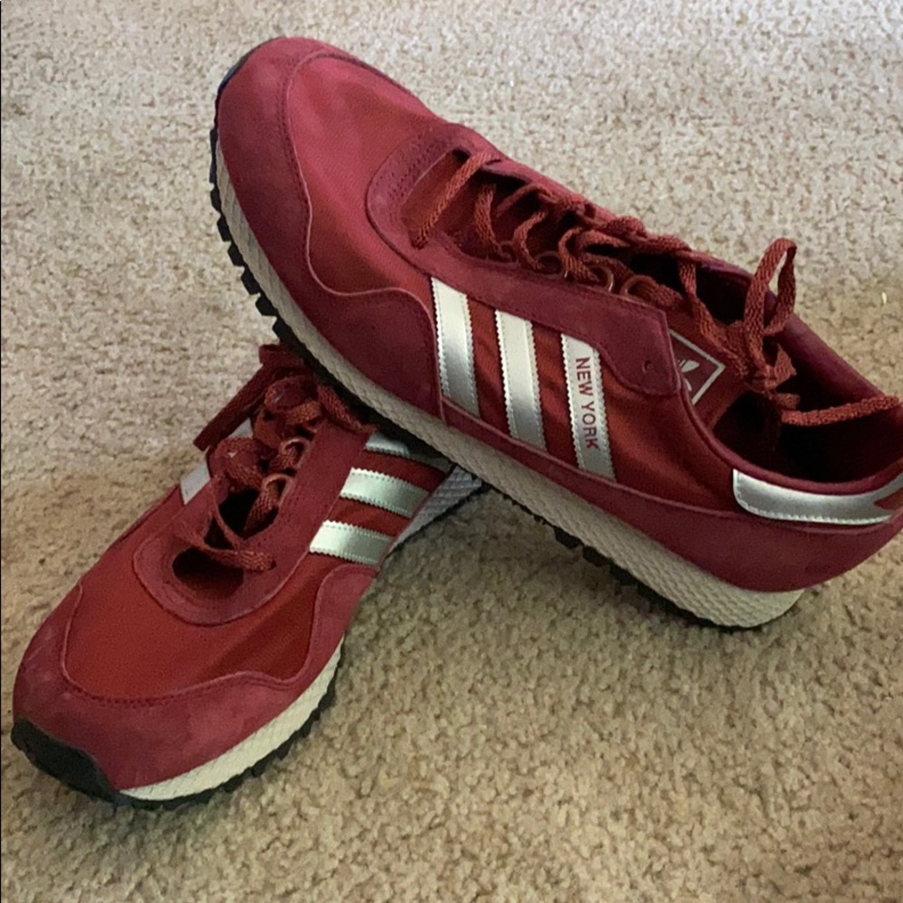 Red adidas sneakers.